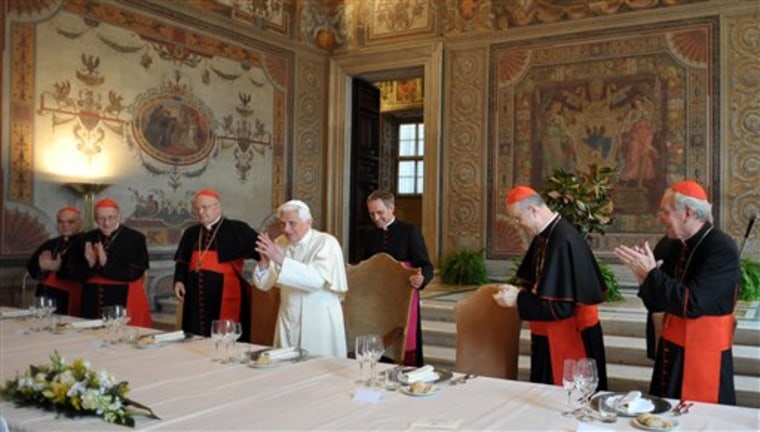 Pope Benedict XVI acknowledges applause during a Vatican luncheon Monday with cardinals to mark the fifth anniversary of his election.